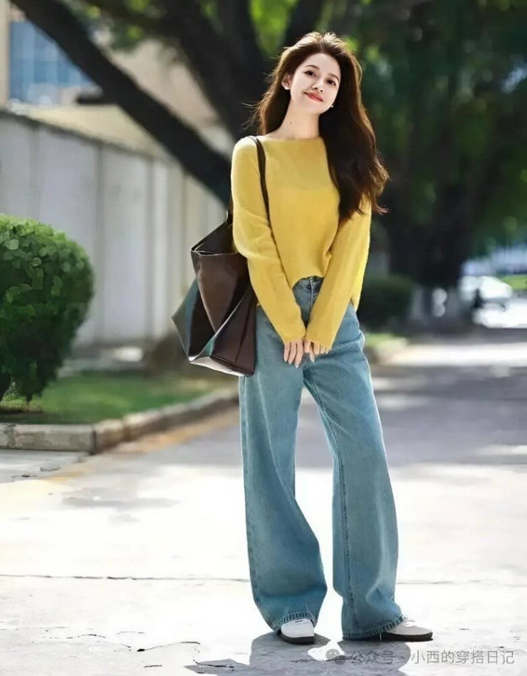 Một chiếc áo len mềm mại đi cùng quần jeans ống rộng sẽ mang đến sự thoải mái và ấm áp.