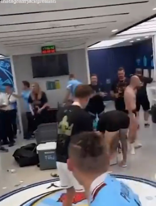 Jack Grealish tells off half-naked Man City kitman during dressing room celebrations  - Bóng Đá