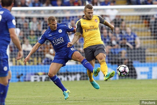 arsenals_jack_wilshere_in_action_with_leicester_citys_marc_albri_295891