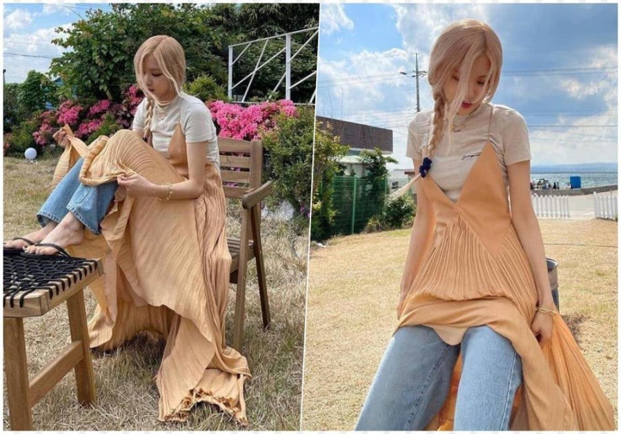 Sự kết hợp giữa váy xẻ tà và quần ống rộng mang đến một tổng thể hài hòa nhưng không kém phần nổi bật.