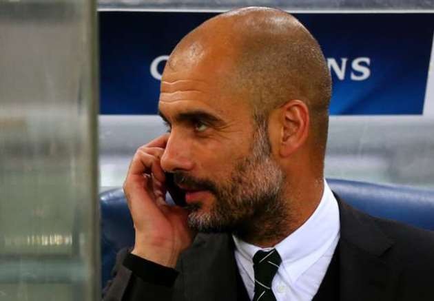 pep-guardiola-manchester-city-phone_1sofxajkwtlmx1ofcm8hrybisw