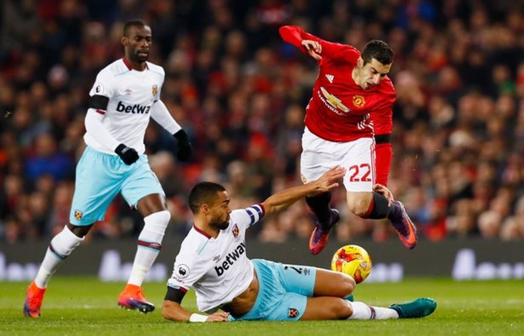 West-Ham-Uniteds-Winston-Reid-in-action-with-Manchester-Uniteds-Henrikh-Mkhitaryan-as-West-Ham-Uni