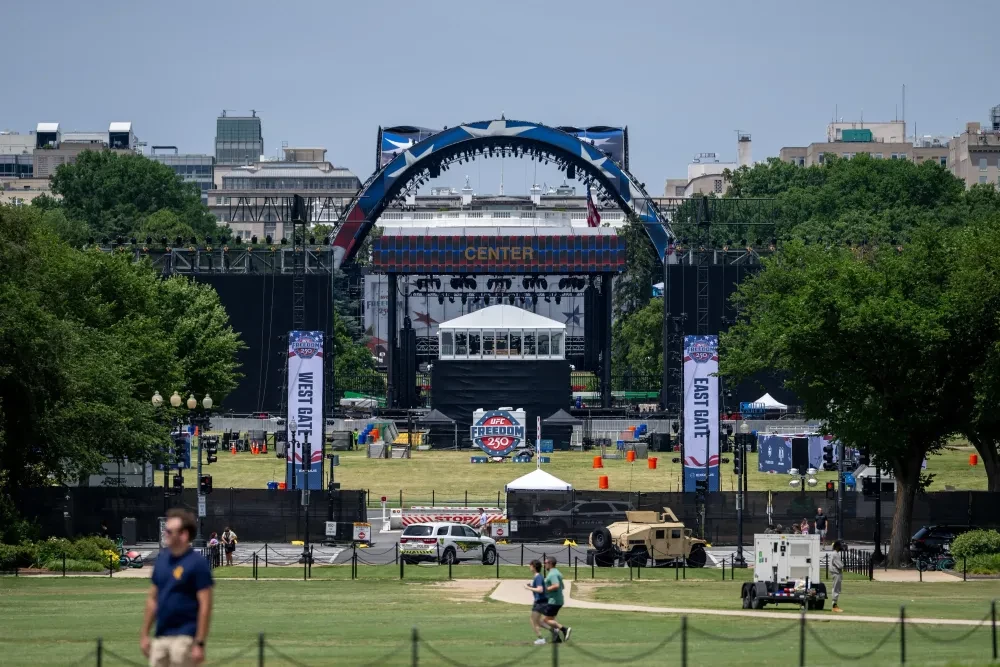 Workers construct a UFC fighting ring ahead of a planned Ultimate Fighting Championship (UFC) fight on the South Lawn of the White House