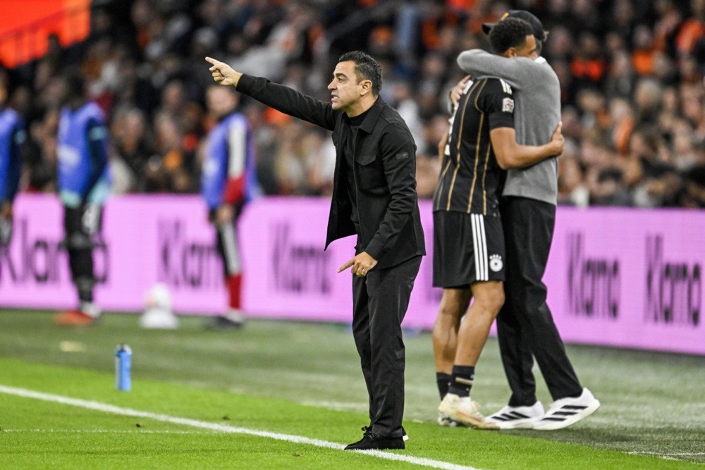 Xavi có trận ra quân khá suôn sẻ. Ảnh: EPA IMAGES. 