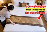 Tại sao giường ngủ khách sạn nào cũng để tấm khăn trải ngang?