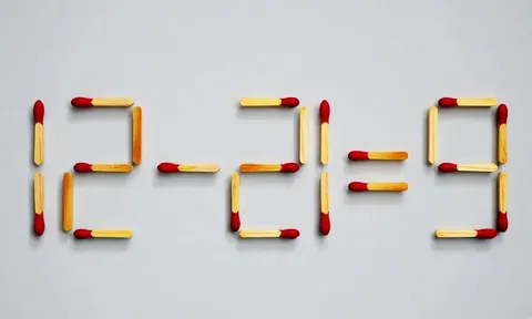 Di chuyển một que diêm để 12-21=9 thành phép tính đúng