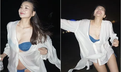 Đệ nhất chân dài Việt mặc bikini nóng bỏng "quậy" giữa biển đêm, 40 tuổi lấy chồng điềm đạm lại siêu giỏi