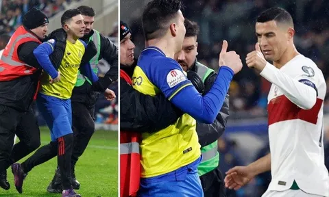 Ronaldo phản ứng đẳng cấp khi fan cuồng chạy vào sân
