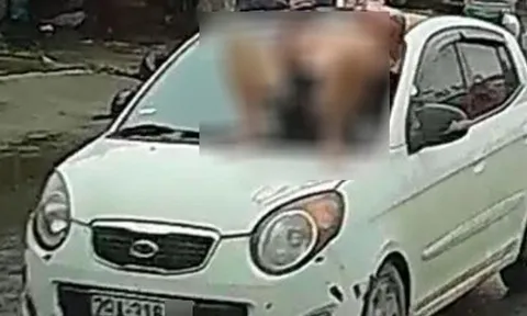 Người đàn ông nằm trên capo ô tô giữa phố Hà Nội: Hé lộ nguyên nhân bất ngờ
