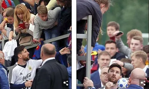 Fan nhí trèo rào để xin chữ ký Lionel Messi