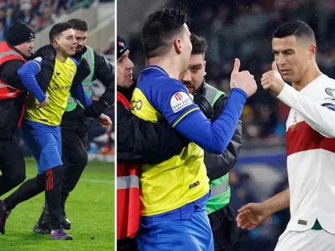 Ronaldo phản ứng đẳng cấp khi fan cuồng chạy vào sân