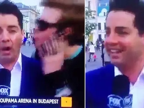 Fan cuồng cưỡng hôn phóng viên World Cup